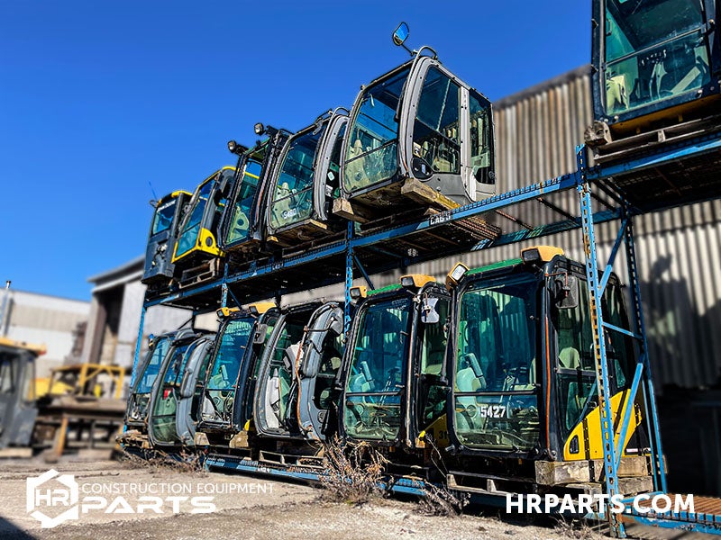 A row of heavy equipment cabs.