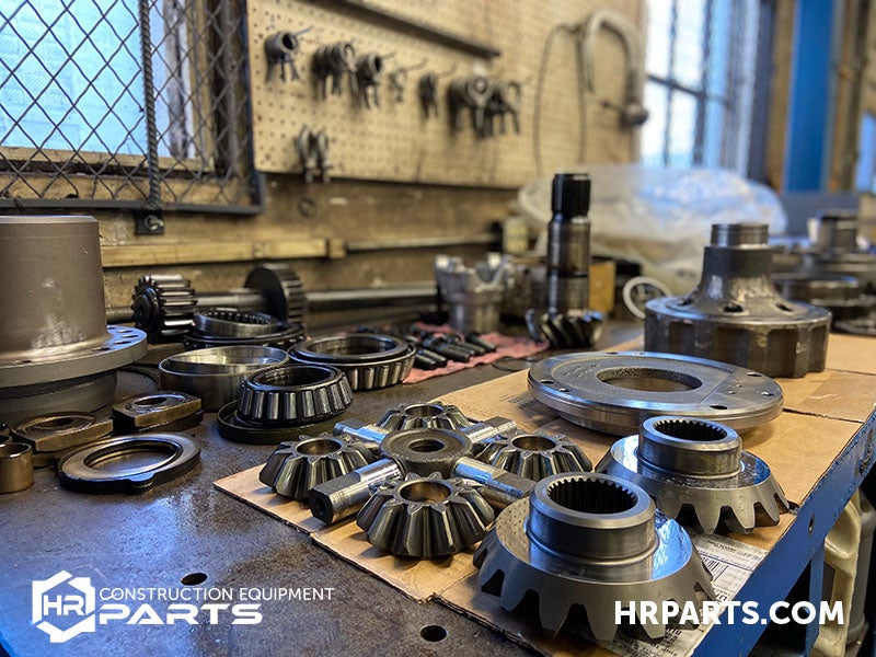 A differential spider shaft and spider gears.