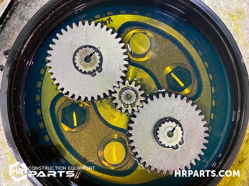 The gears of a final drive sit in a bath of oil.