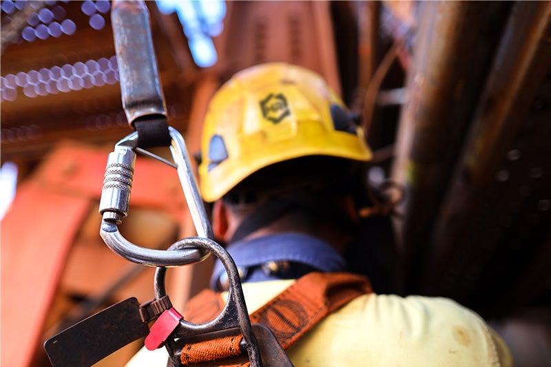A worker in a safety harness.