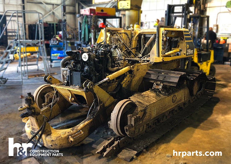A Komatsu D39PX-23 being salvaged.