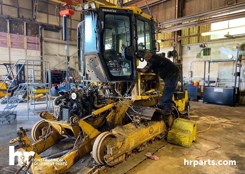 A Komatsu D39PX-23 being salvaged.