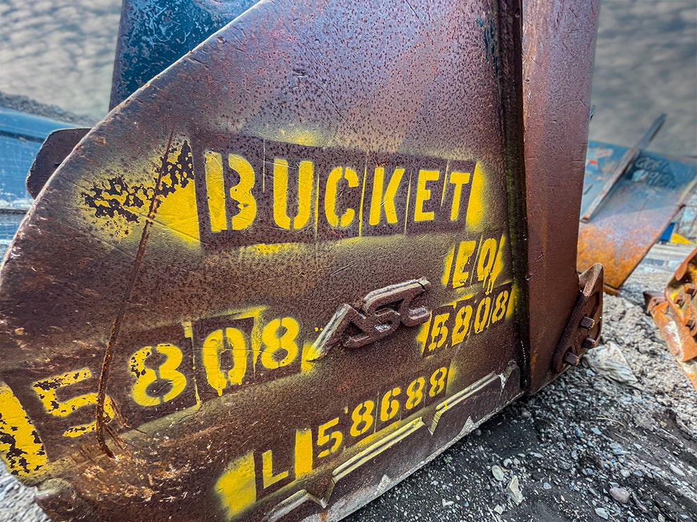 Bucket 5808 is spray painted on the side of a bucket