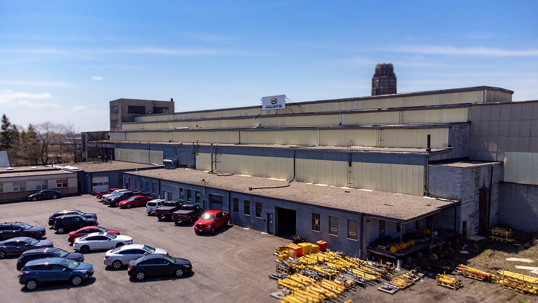 an aerial of the warehouse with parts overflowing
