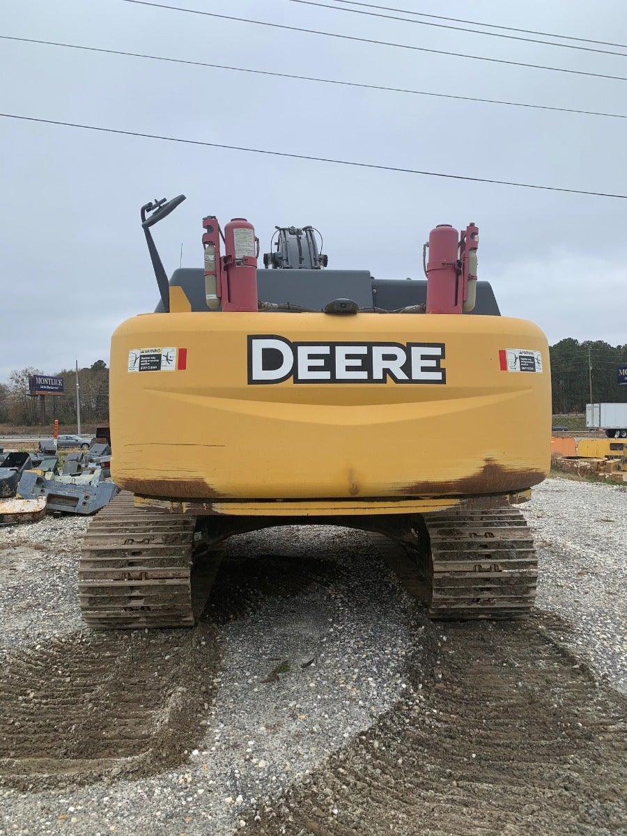 John Deere 350G LC leaves the heavy equipment salvage yard 1