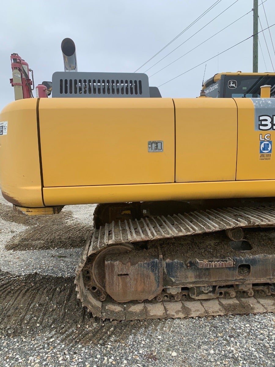 John Deere 350G LC leaves the heavy equipment salvage yard 2