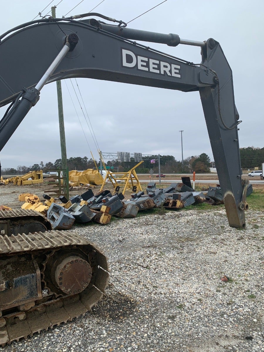 John Deere 350G LC leaves the heavy equipment salvage yard 5