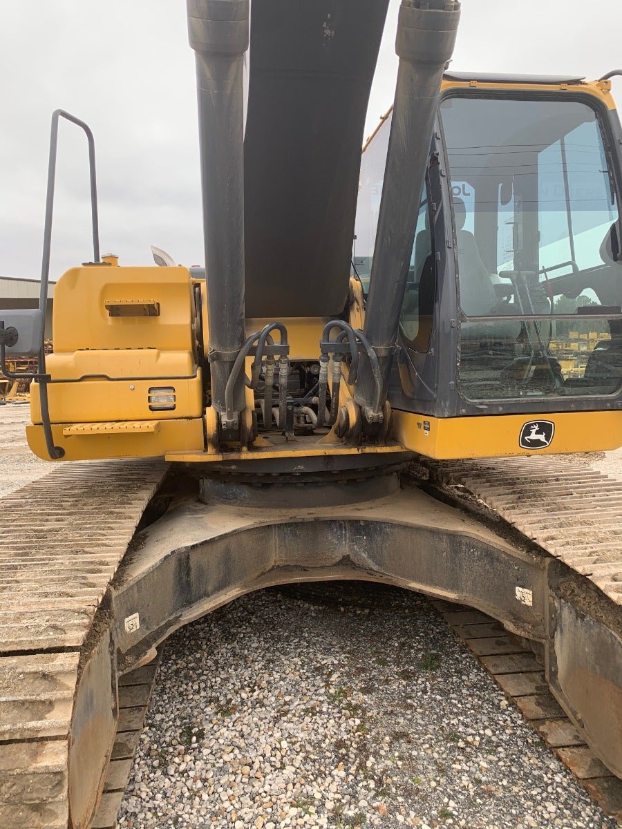 John Deere 350G LC leaves the heavy equipment salvage yard 6