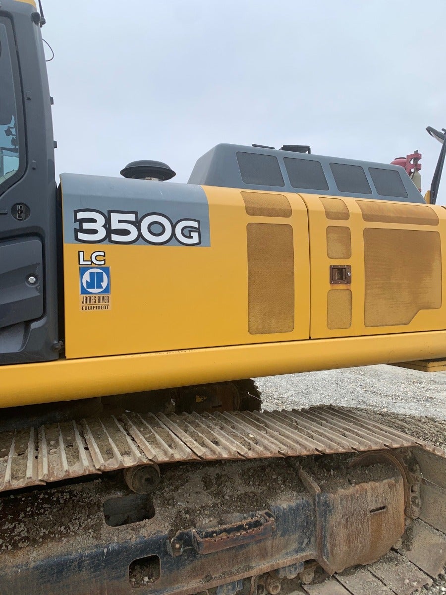 John Deere 350G LC leaves the heavy equipment salvage yard 7